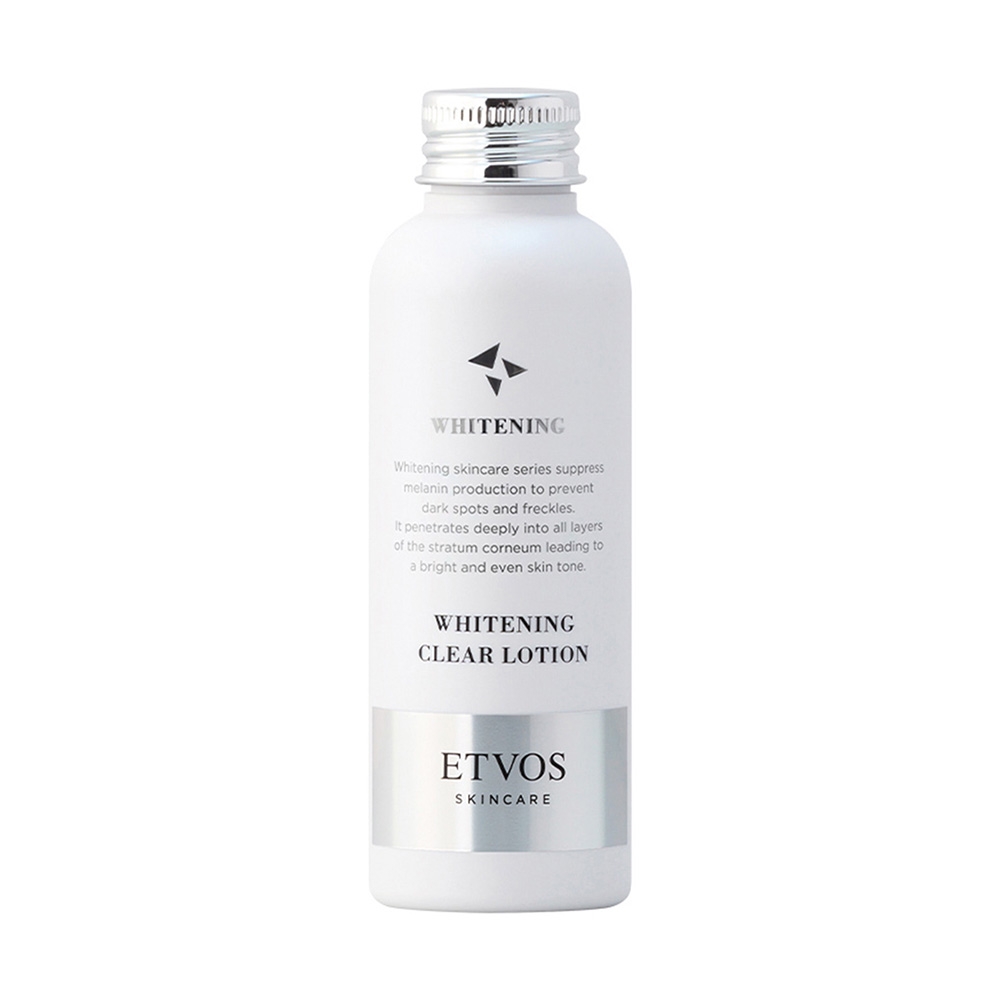 White bottle of Etvos Whitening Clear Lotion with silver cap and text detailing its skincare benefits.