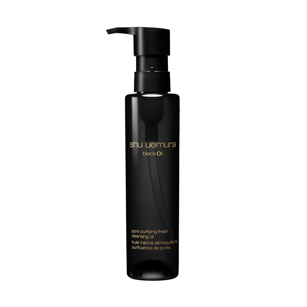 A sleek black bottle of Shu Uemura black oil, featuring a pump dispenser and gold text, designed for pore-purifying cleansing.