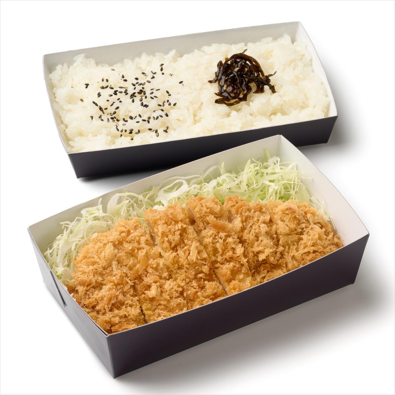 2点の弁当箱。1点にはごまと海苔をのせた白ご飯、もう1点にはキャベツの千切りとサクサクとした黄金色のロースかつ。とんかつ和幸、ロースカツ弁当