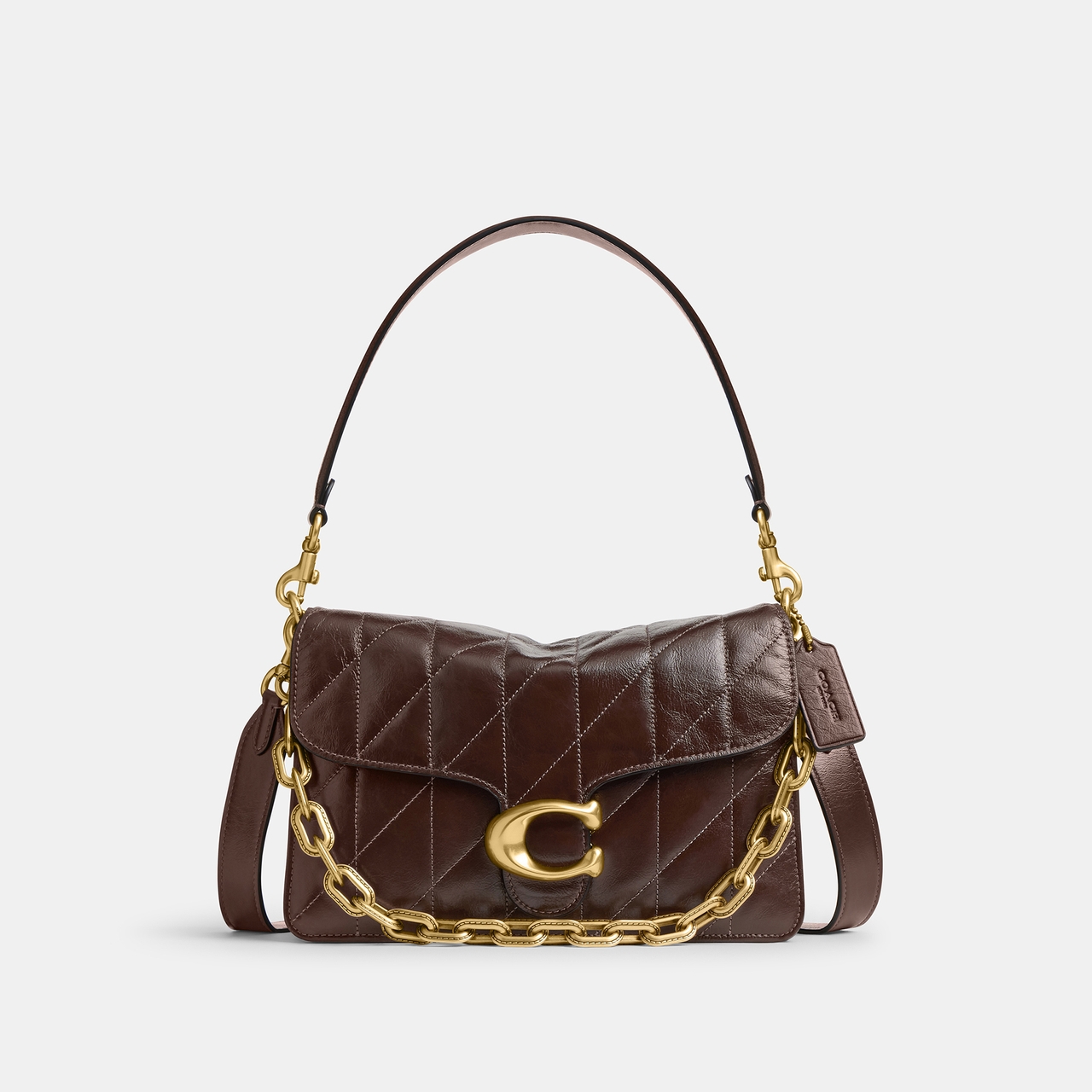 Brown quilted leather handbag by COACH with a gold chain strap and a large gold "C" clasp on the front.