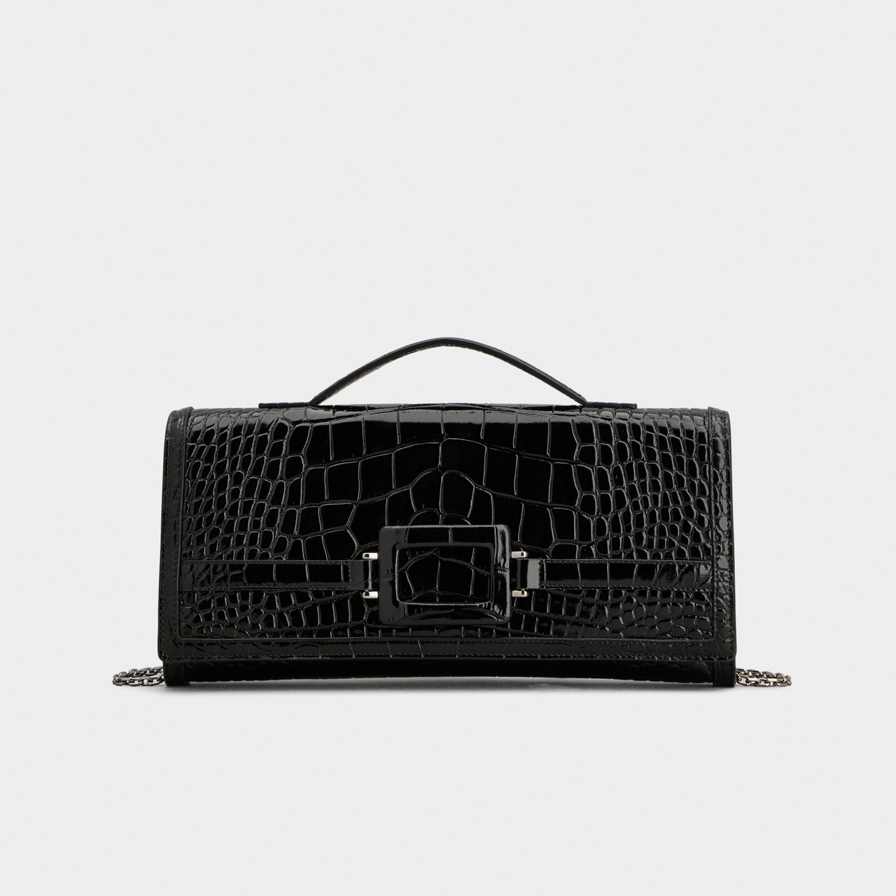 Black crocodile-pattern handbag with a buckle detail, top handle, and a chain strap on a plain white background.