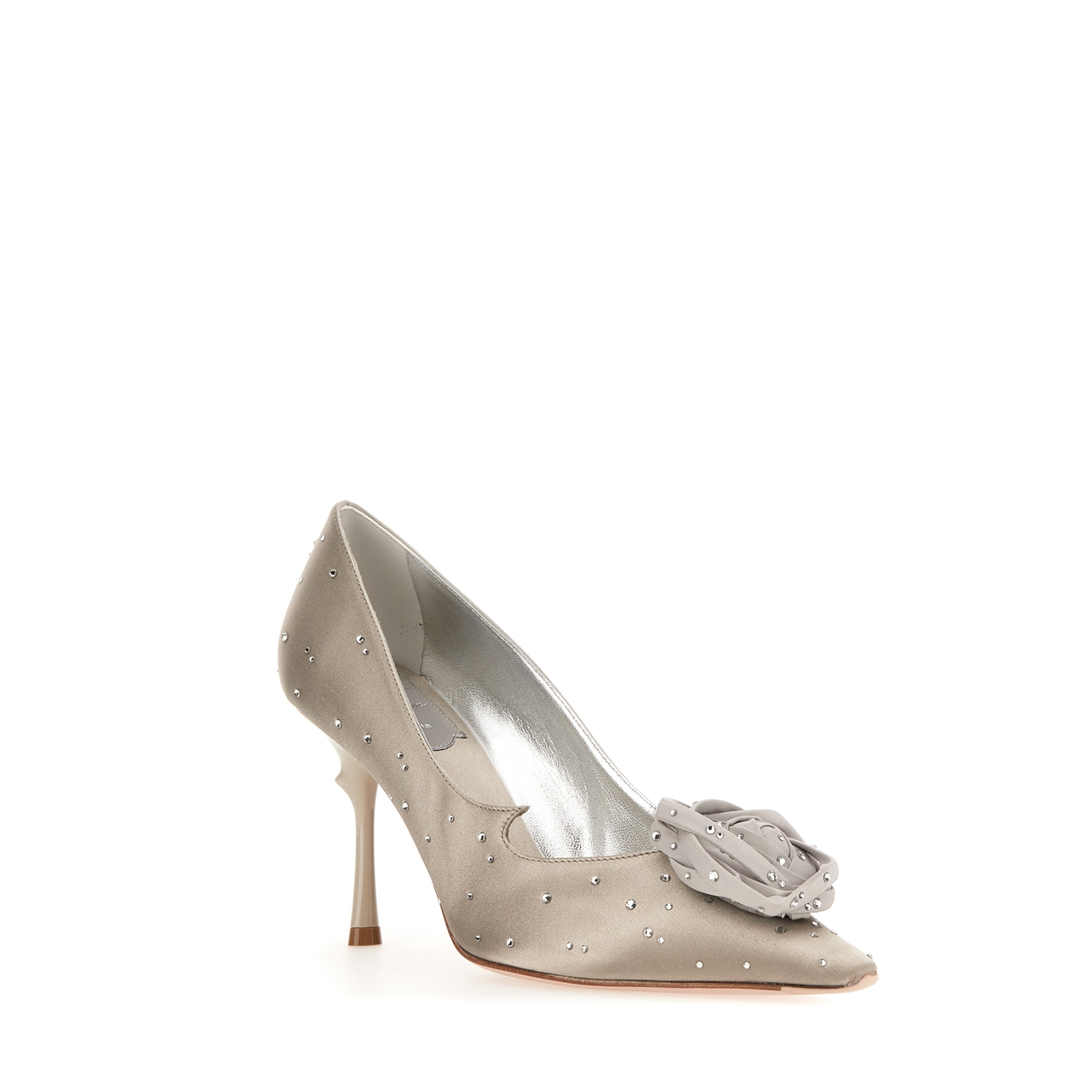 Elegant high-heeled shoe with rhinestone details and a fabric flower embellishment on the toe, in a light taupe color.