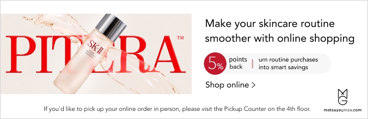 Advertisement for SK-II skincare, featuring a bottle of product with text promoting online shopping and 5% points back.