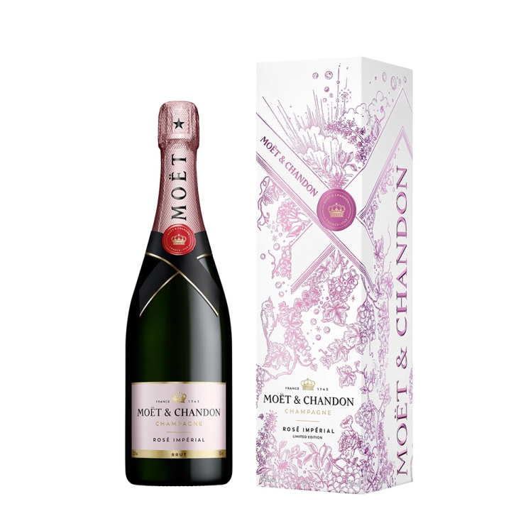 Bottle of Moët & Chandon Rosé Impérial champagne next to a decorative pink and white box with floral patterns and branding.